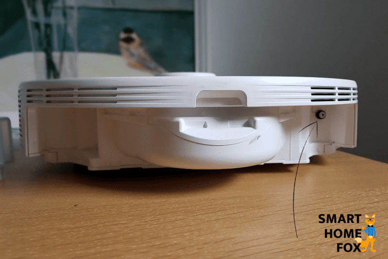 A close-up of the water outlet of a robot vacuum with a mopping function